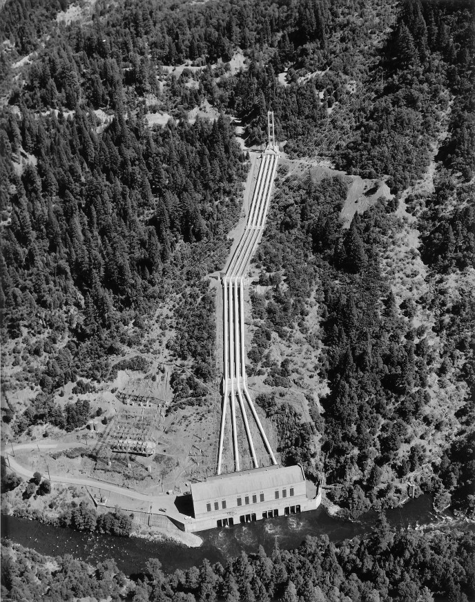 Pipes going up  a hillside for a hydroelectric power plant