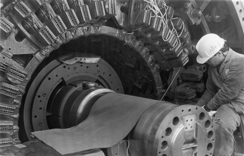 A worker at the armature of a multi-megawatt generator