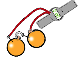 digital watch connected to two coins stuck in two oranges