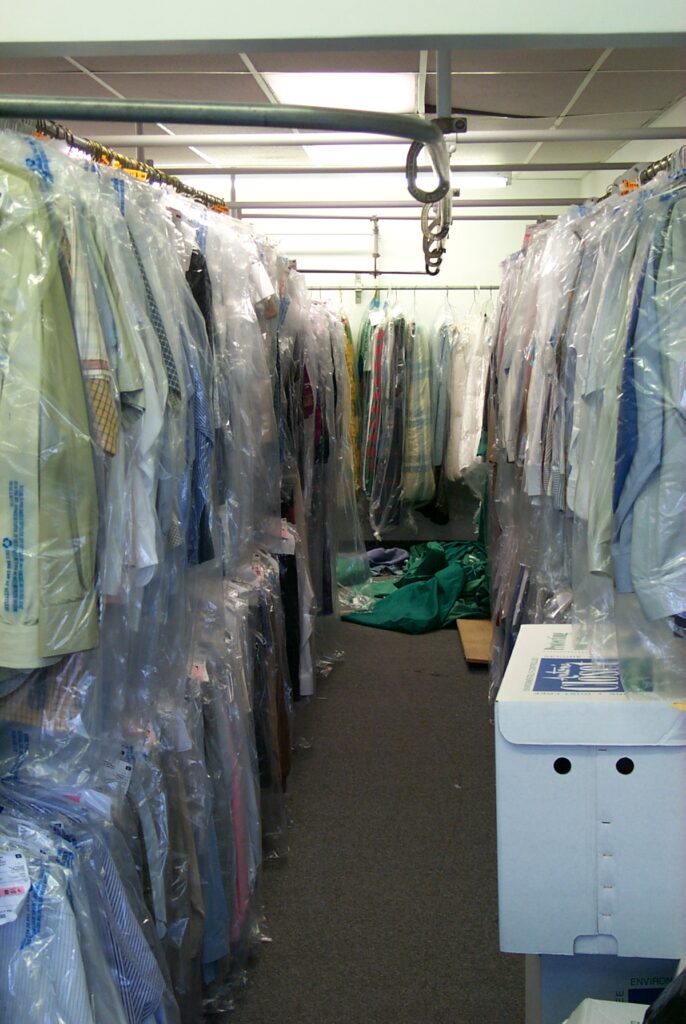 Dry  cleaning service—clothes hung on bars