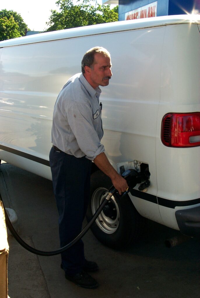 Man refueling a van