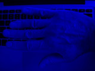Hand in blue light