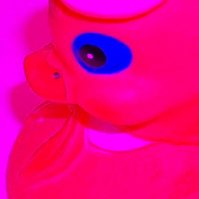 Image of rubber duck with only red light displayed.